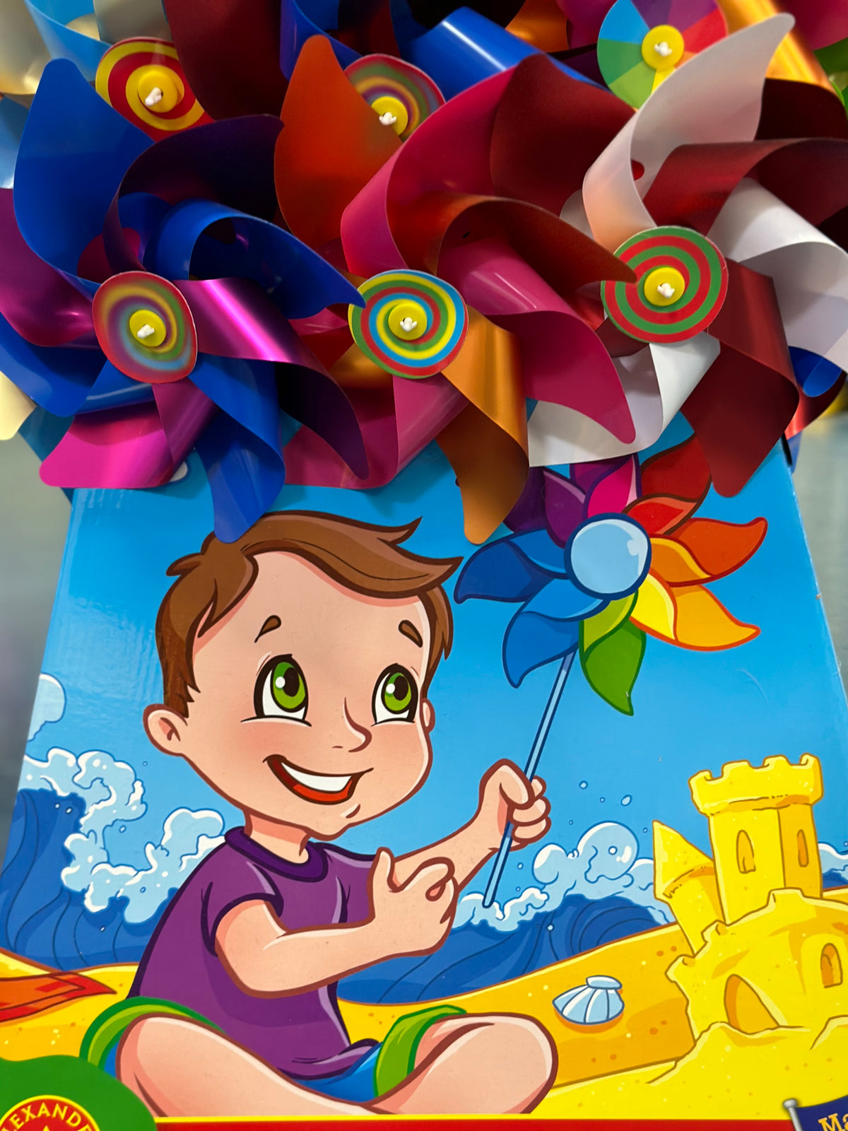 Colourful Rainbow Windmill On A Stick